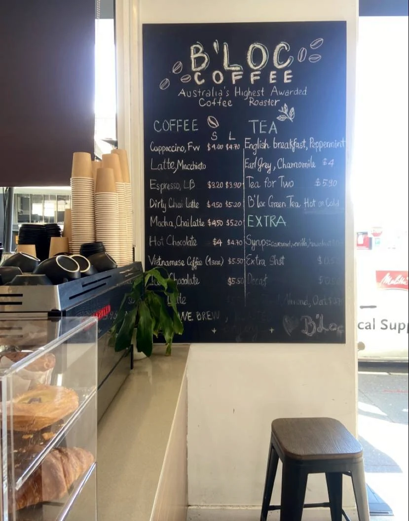 The coffee counter and chalkboard inside Cafe B’Loc